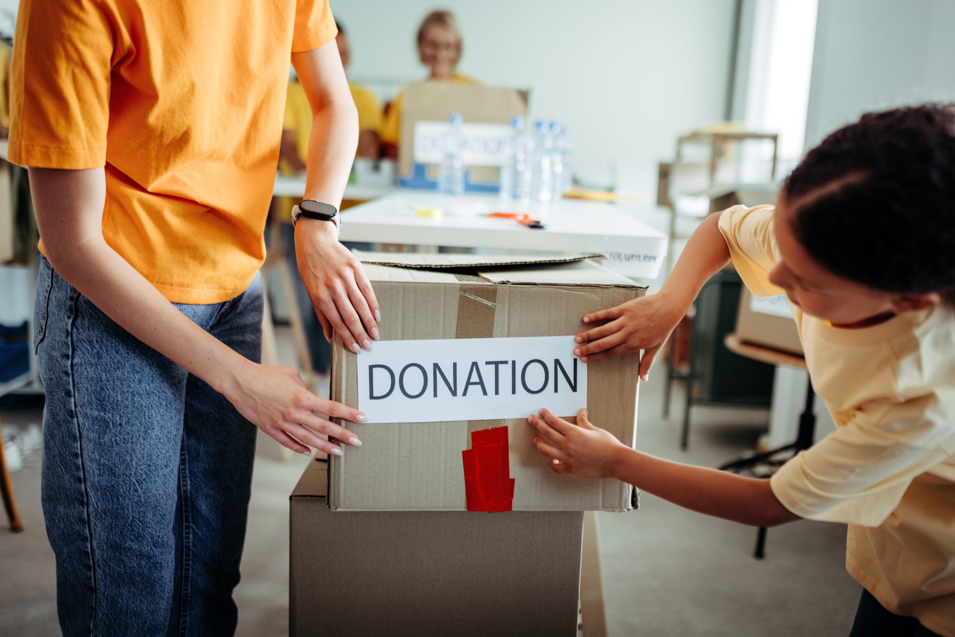 Donation box being labeled by volunteers